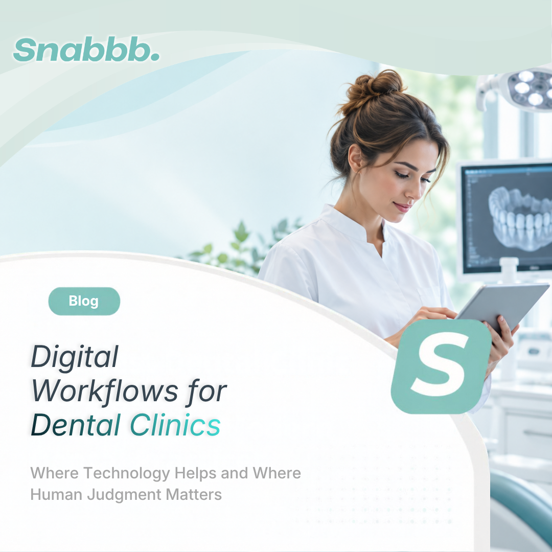 Dental professional using a digital clinic management system to review patient information, appointments, charting, and daily workflow in a modern dental clinic.